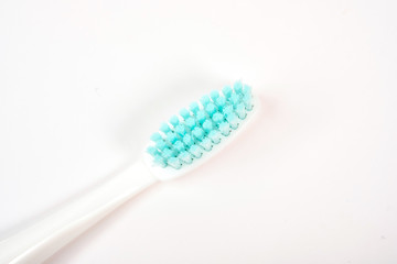 Fototapeta na wymiar Colorful toothbrushes close-up on a white background. Oral hygiene. care for the oral cavity