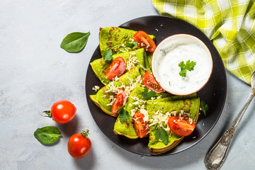 Green pancakes from spinach top view.