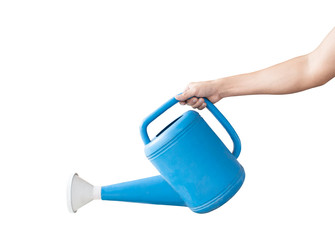 Hand holding a blue watering can, Isolated on white background with clipping path. Concept of...