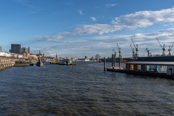 Stunning panoramic view of the Port of Hamburg towards the submarine with some cranes and ships