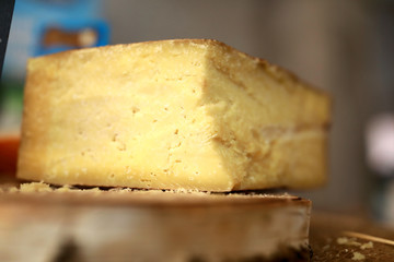 Piece of yellow cheese on counter