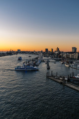 Fototapeta na wymiar Panoramic view of the Port of Hamburg in the Hafen City at Elbe river at sunset/twilight
