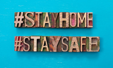 Stay Home, Stay Safe text written with wood type blocks