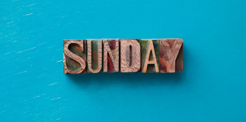 Sunday word written with wood type blocks