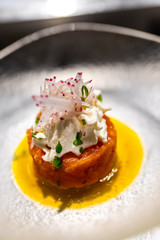 Fresh tartar with salmon on a plate close-up