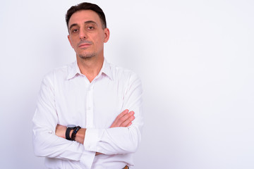 Mature handsome Italian businessman against white background