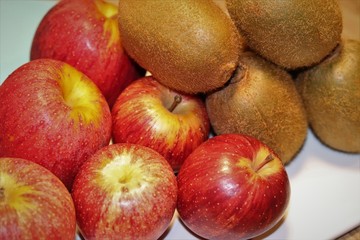 Naklejka na ściany i meble Delicious apples and kiwis. Fruits rich in nutrients.