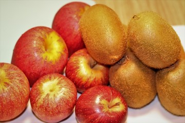 Fototapeta na wymiar Delicious apples and kiwis. Fruits rich in nutrients.