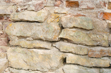 Background of the stone wall of an ancient cave