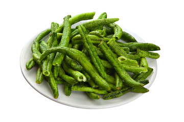 green beans pods on awhite plate on White background