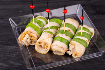 Canape meat, inside with cheese and mushrooms with greens