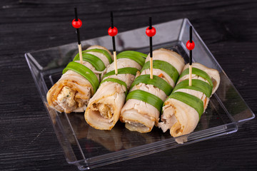 Canape meat, inside with cheese and mushrooms with greens