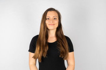 Obraz premium Young woman happy in black shirt with long hair