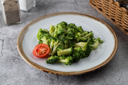 Steamed broccoli as a light dietary garnish in a restaurant