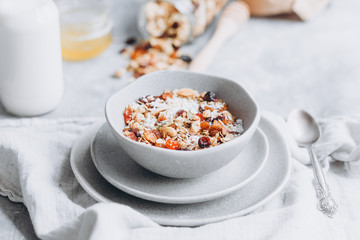 Homemade granola with milk in a plate