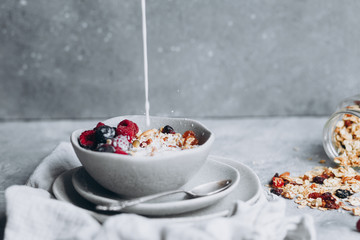 Homemade granola with milk in a plate