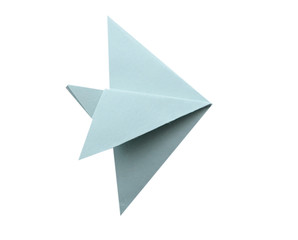 A blue origami fish isolated white