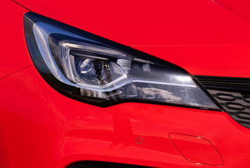 Front light of a new red car