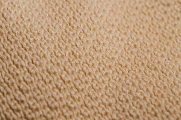 Knitted fabric wool texture close up as a background.