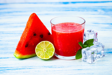Glass of watermelon juice, lime, mint and ice