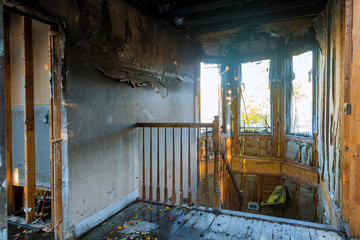 Burned house interior after fire room inside