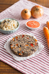 brown raw vegan burgers prepared at home with fresh ingredients