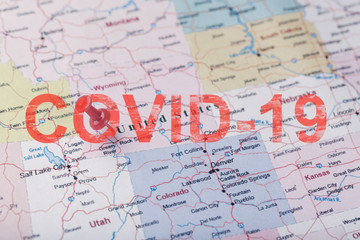 Red stationery needle on the map of the United States, Wyoming and the capital of Cheyenne, indicating the city of the spread of the coronavirus pandemic covid-19 infection