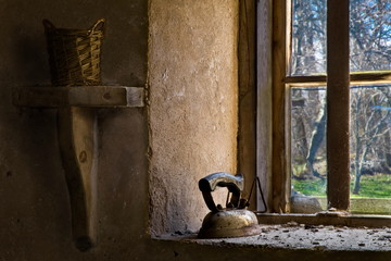 In the old country house there is an antique iron on the window