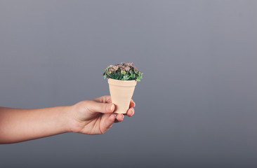 woman hand artificial flower