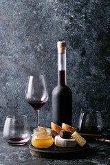 Glass of red wine served with cheese