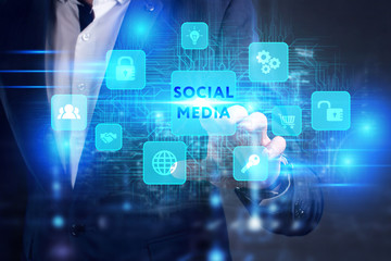 Business, Technology, Internet and network concept. Young businessman working on a virtual screen of the future and sees the inscription: Social media