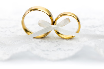 Gentle Wedding Celebration background - pair of wedding rings with bow