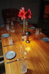 vase with bouquet of flowers on table in restaurant