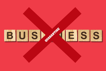 Quarantine for business. The inscription on wooden blocks crossed out by red lines. Finance.
