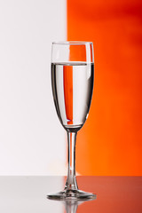 Three glasses of wine against colorful background