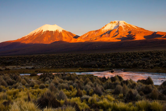 Sunset in Andes. Parinacota and Pomerade volcanos - Bolivia