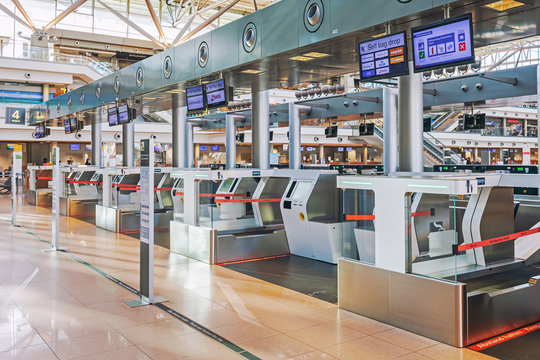 Hamburg, Germany - March 29 2020: Self bag drop kiosks at Hamburg airport, empty because of Covid-19 pandemic