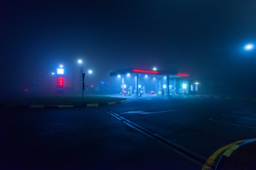 Night gas station in the fog