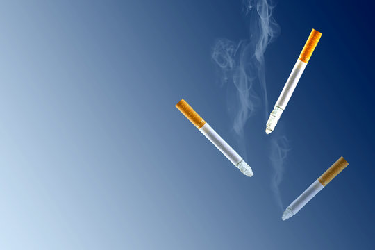 Cigarettes on black blue background with copy space. Stop Smoking.
