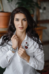 Fashion luxury lady in shirt. Photography of a Attractive girl. Beauty woman in white shirt posing in grey studio. Trendy portrait of seductive sexy girl model in underwear.