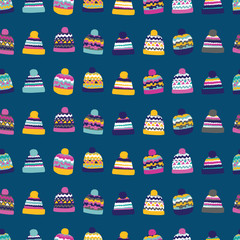 Colourful bobble winter hats on blue background. Great for home decor, wrapping, scrapbooking, wallpaper, gift, kids. 