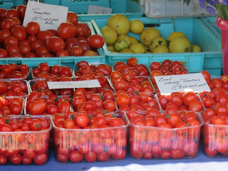 fresh tomatoes on a market stall
