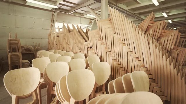 Wooden storage and chairs. Wood furniture factory