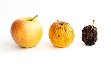 Three apples: young, old, dead. Concept of aging of human skin of different ages. On white...