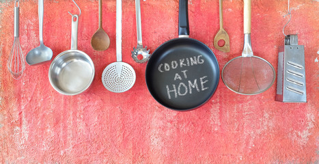 Cooking at home during corona virus lockdown, kitchen utensils and message, concept