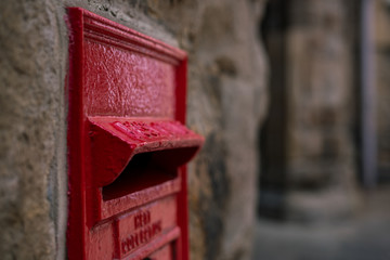 red post box on the wall