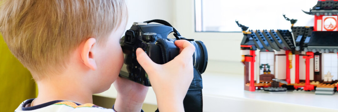a 6 year old boy photographs his toys