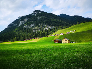 Fototapeta premium Village on the mountains in spring
