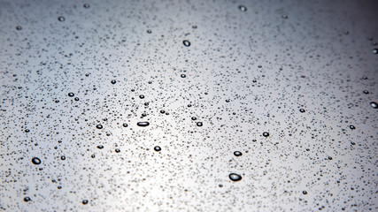 small drops of water on a plastic surface. texture and abstract background