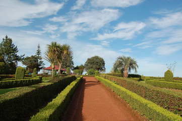 Fototapeta na wymiar Beautiful paths to walk through the viewpoint of the garden of Ponta do Sossego, São Miguel, Azores Islands, Portugal. Jardim do Miradouro da Ponta do Sossego